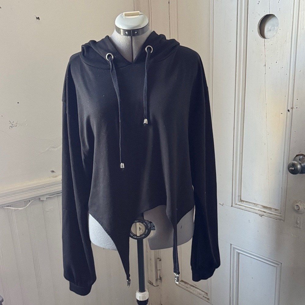 Disturbia cropped hoodie with garter clips.